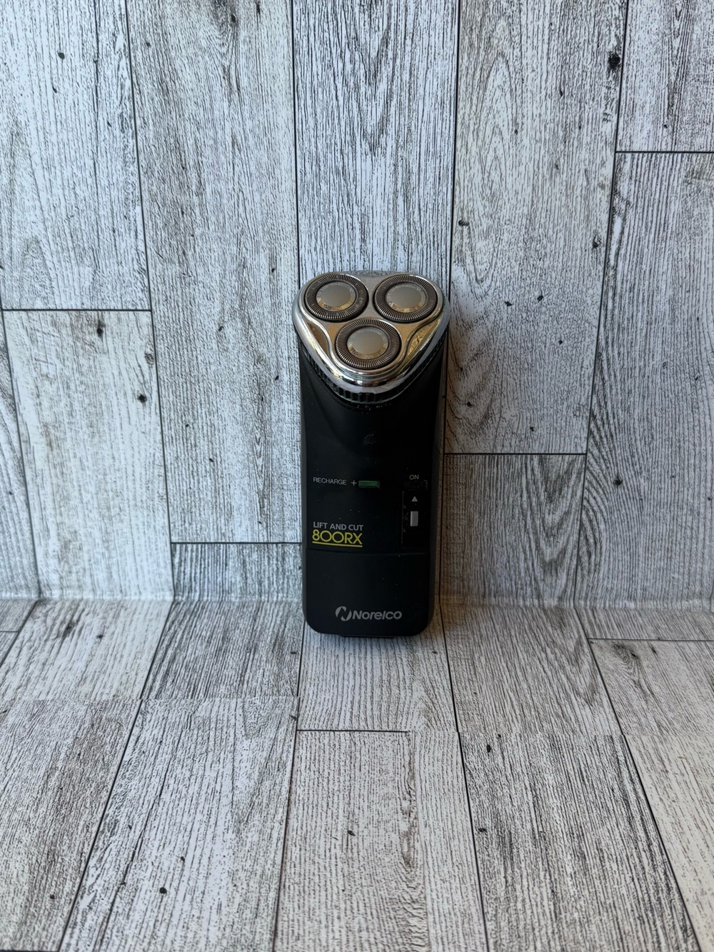 vintage Norelco 800RX rechargeable triple-head electric shaver.